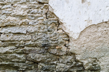 Old damaged stone and concrete wall