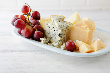 blue cheese and grapes on plate