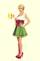 Beautiful bavarian woman with beer.