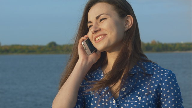 Beautiful woman calling with mobile phone.