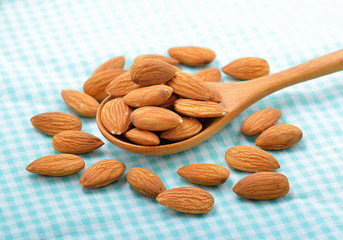 almonds on wood spoon