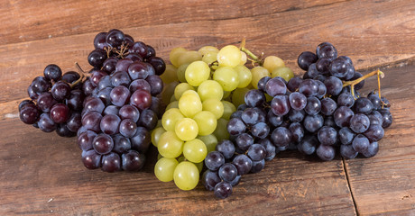 Bunches of white and black grapes