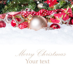 Christmas background with a red ornament on snow, Holiday decoration 