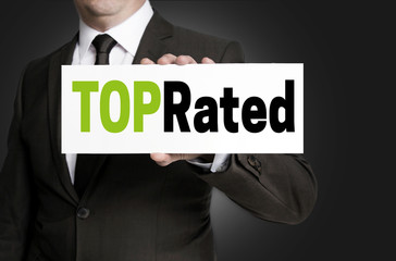 Top Rated sign is held by businessman concept