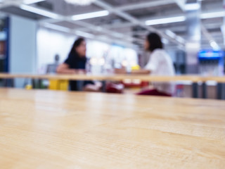 Top of table with blurred women in cafe restaurant background