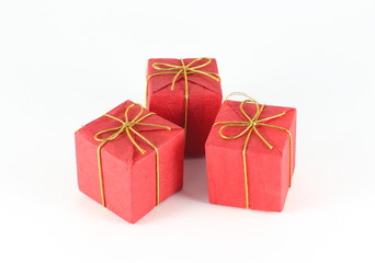 Gift box wrap red paper with gold ribbon and isolated background