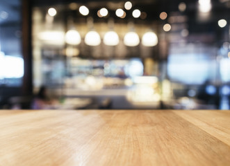 Table top with Blurred Bar restaurant cafe interior background - obrazy, fototapety, plakaty
