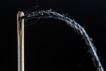 needle on a black background
