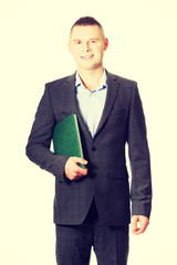 Young businessman holding his note book