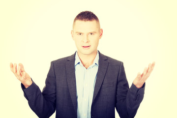 Angry businessman with open hands