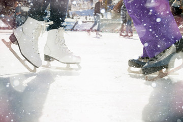 Closeup skating shoes ice skating outdoor at ice rink - obrazy, fototapety, plakaty