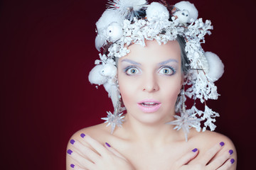 Frozen woman with winter hairstyle and Christmas makeup