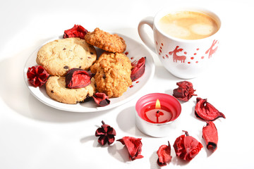 Christmas cup of coffee with cookies and red candle