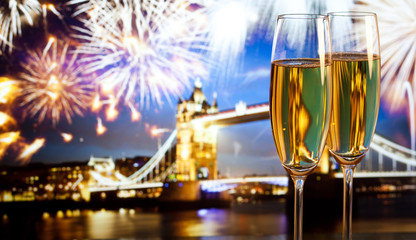 New Year celebration in the city - champagne glasses and Tower b