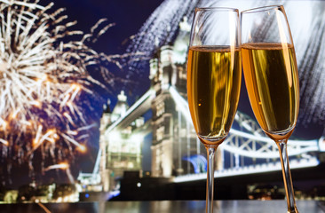 New Year celebration in the city - champagne glasses and Tower b
