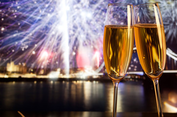 New Year celebration in the city - champagne glasses and Tower b