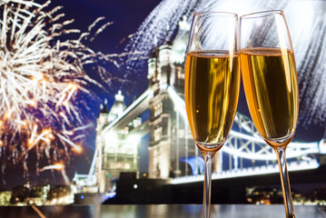 New Year celebration in the city - champagne glasses and Tower b