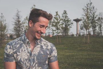 Young handsome man posing in the street