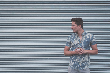 Young handsome man posing in the street