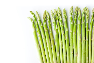 Green asparagus at the right of white background