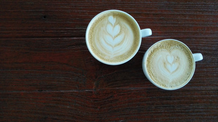 Coffee cup top view on wooden table background