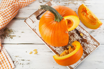 Autumn halloween pumpkin on wooden background.