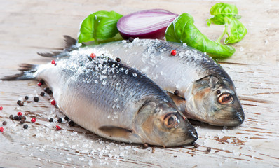 Herring on a wooden background.