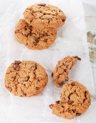 Chocolate chip cookies on white paper.