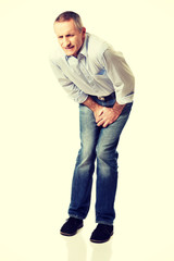 Fototapeta premium Man covering his painful crotch