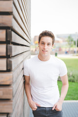 Obraz premium Young handsome caucasian brown hair man ballet dancer posing and dancing in the street of the city - movement, dancing, elegance concept