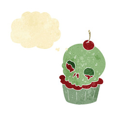 cartoon halloween cup cake with thought bubble