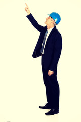 Businessman engineer pointing up