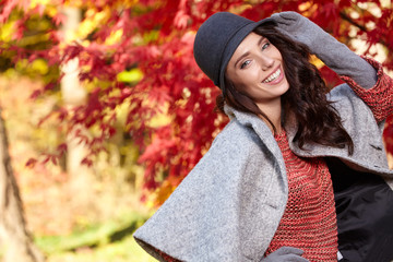 Beautiful woman in autumn park