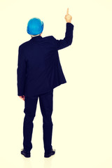 Businessman engineer pointing up