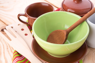 plates and cups on wooden table