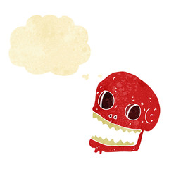 cartoon spooky skull with thought bubble