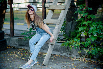 beautiful girl in denim overalls