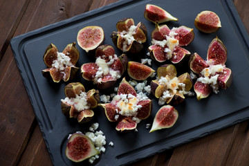 Fresh fig fruits baked with cottage cheese and honey, closeup