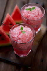 Close-up of two glasses with watermelon granita, selective focus
