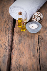 spa massage setting, nature product, oil on wooden background