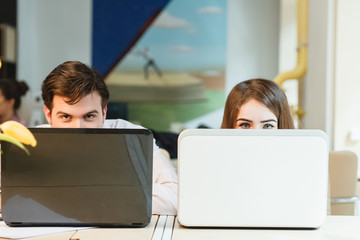 happy young relaxed couple working on laptop computer