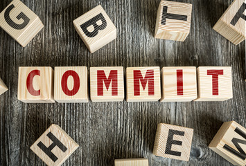 Wooden Blocks with the text: Commit
