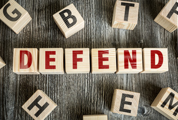 Wooden Blocks with the text: Defend