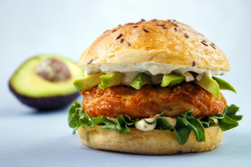 Avocado fish sandwich with brioche bun , mayonnaise and lettuce