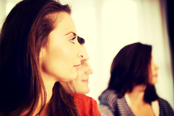 Sisters and brother relaxing at home.
