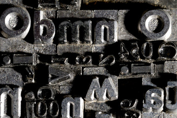 Metal Lettrpress Types.
A background from many historic typographical letters in black and white with white background.

