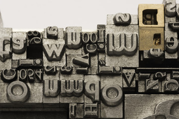 Metal Lettrpress Types.
A background from many historic typographical letters in black and white with white background.
