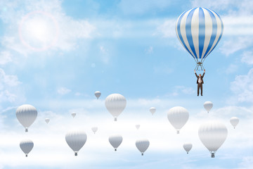 Fototapeta na wymiar Businessman holding blue balloon