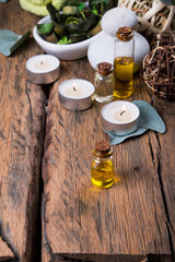 spa massage setting, nature product, oil on wooden background
