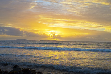 Fototapeta premium yellow sunset and soft waves at beal beach